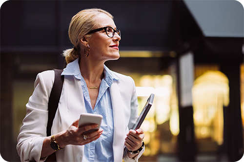 Woman lawyer holding a cell phone and a tablet Woman lawyer holding a cell phone and a tablet